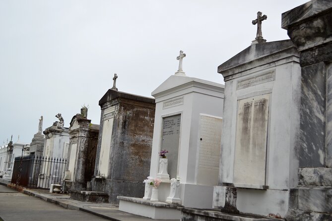 New Orleans Cemetery Bus Tour with Exclusive Cemetery Access - Katrina memorial and Charity Hospital cemetery grounds: what the tour handles with care