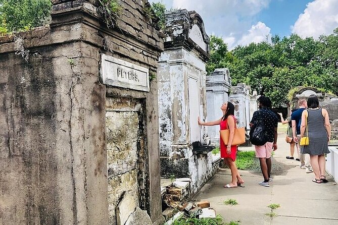 New Orleans City and Cemetery Tour with Garden District Stroll - Jackson Square Drive-By Landmarks and Why They Matter